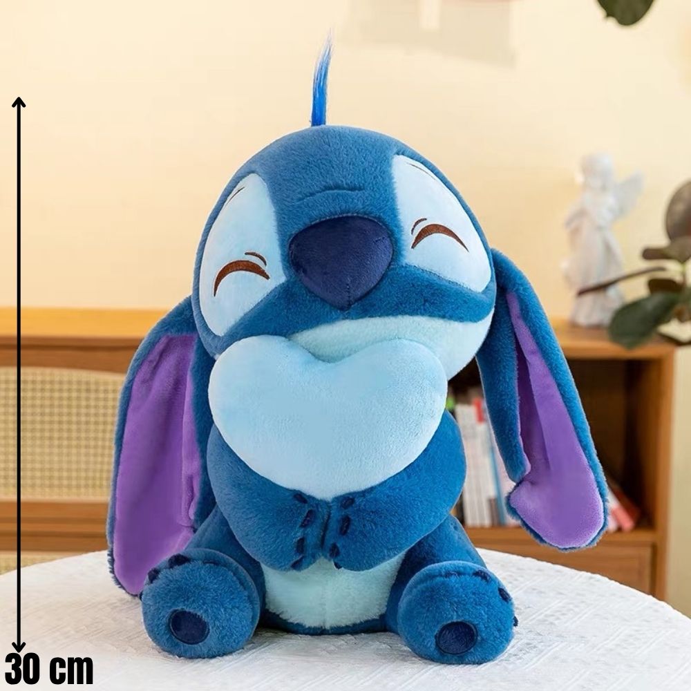 Plavi plišani jastuk stitch s ljubičastim ušima i trbušnim dijelom te zatvorenim osmijehom