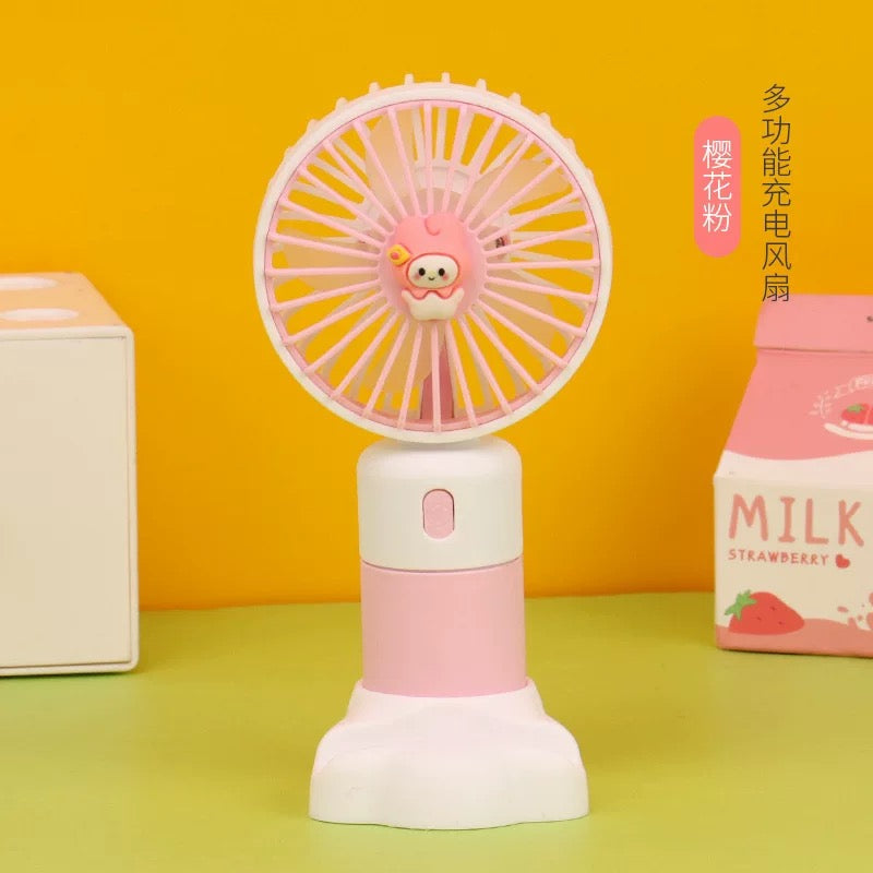 Roza i bijeli mini ventilator s crtanim likom i USB punjenjem