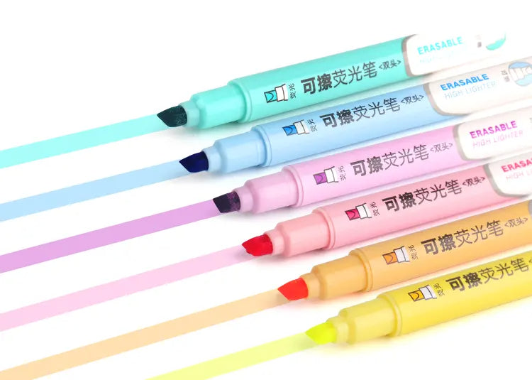 Pastel boje brisivih markera s odgovarajućim tragovima na papiru
