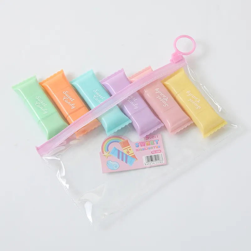 Pastel-kolorirani pribor za pisanje s motivom slatkiša u prozirnoj torbici