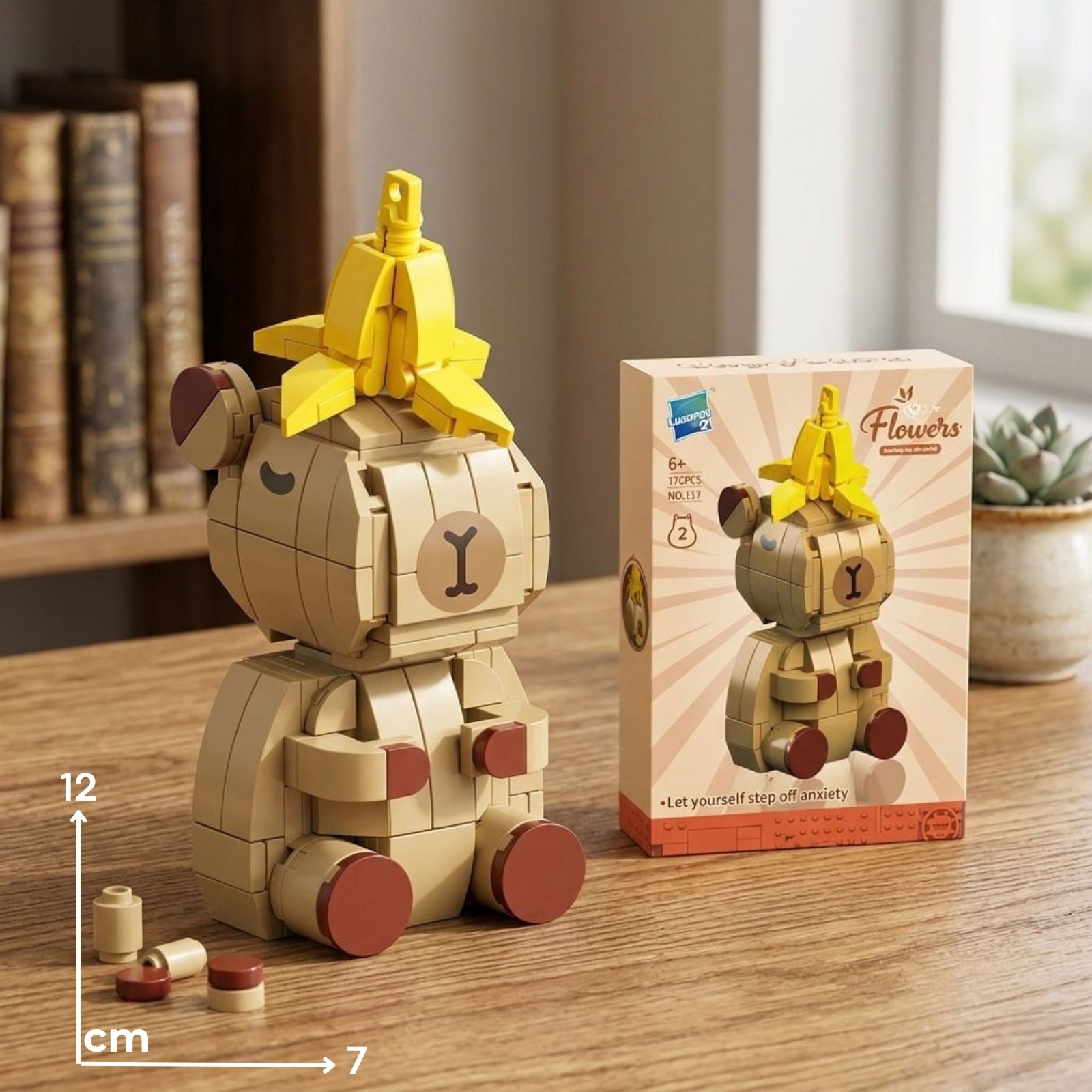 Bež i smeđi lego-stil figurica medvjeda s šeširom u obliku žute banane capybara banana lego 2 model