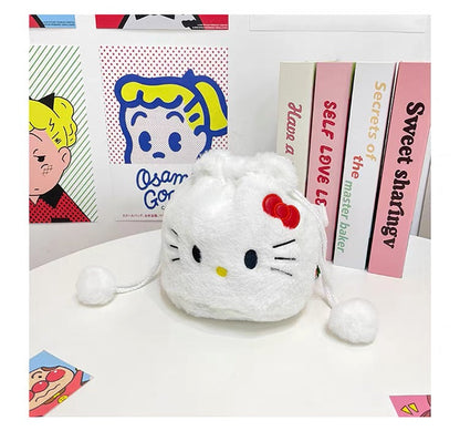 Bijela pahuljasta hello kitty torbica s crvenom mašnom i resicama na vrhovima za vezanje