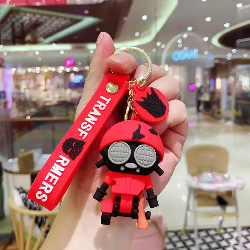 Crveno-crni crtani robot privjesak TRANSFORMERS PRIVJESAK5 za kolekcionare