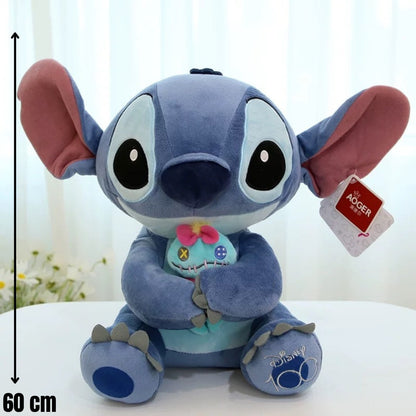 Plavi plišani stitch jastuk 60cm drži malenog šivanog lutka s ružičastom mašnom od mekog materijala