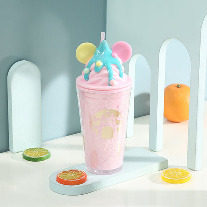 Pink cup with decorative topping from the Cream Cat Latte Flaša product