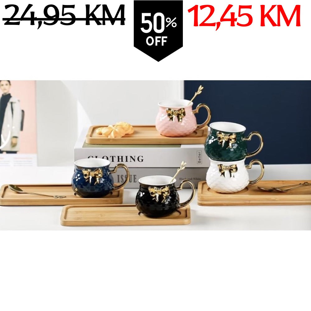 Set od četiri keramičke šolje u ružičastoj, zelenoj, tamnoplavoj i crnoj boji s zlatnim mašnama