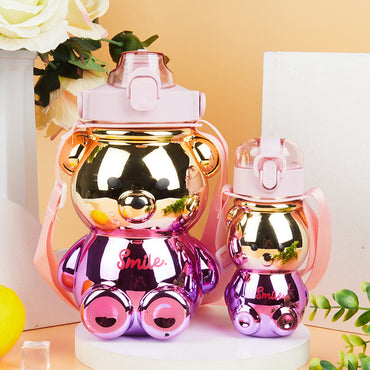 Shiny pink and gold bear-shaped water bottles in Medo Flaša Set 2Kom