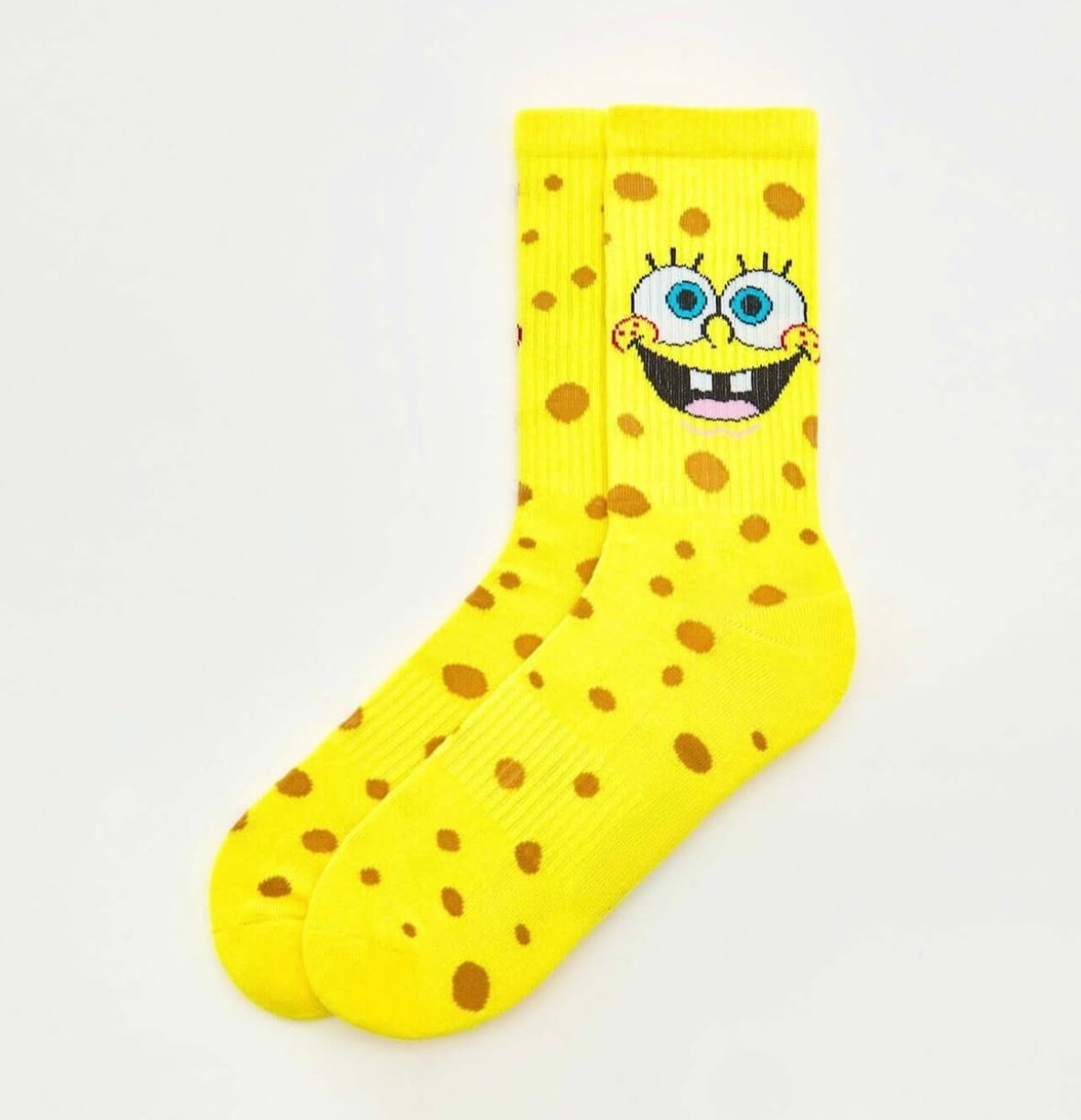 Svijetlo žute spongebob čarape s veselim licem plavim očima i smeđim mrljama za svakodnevnu uporabu