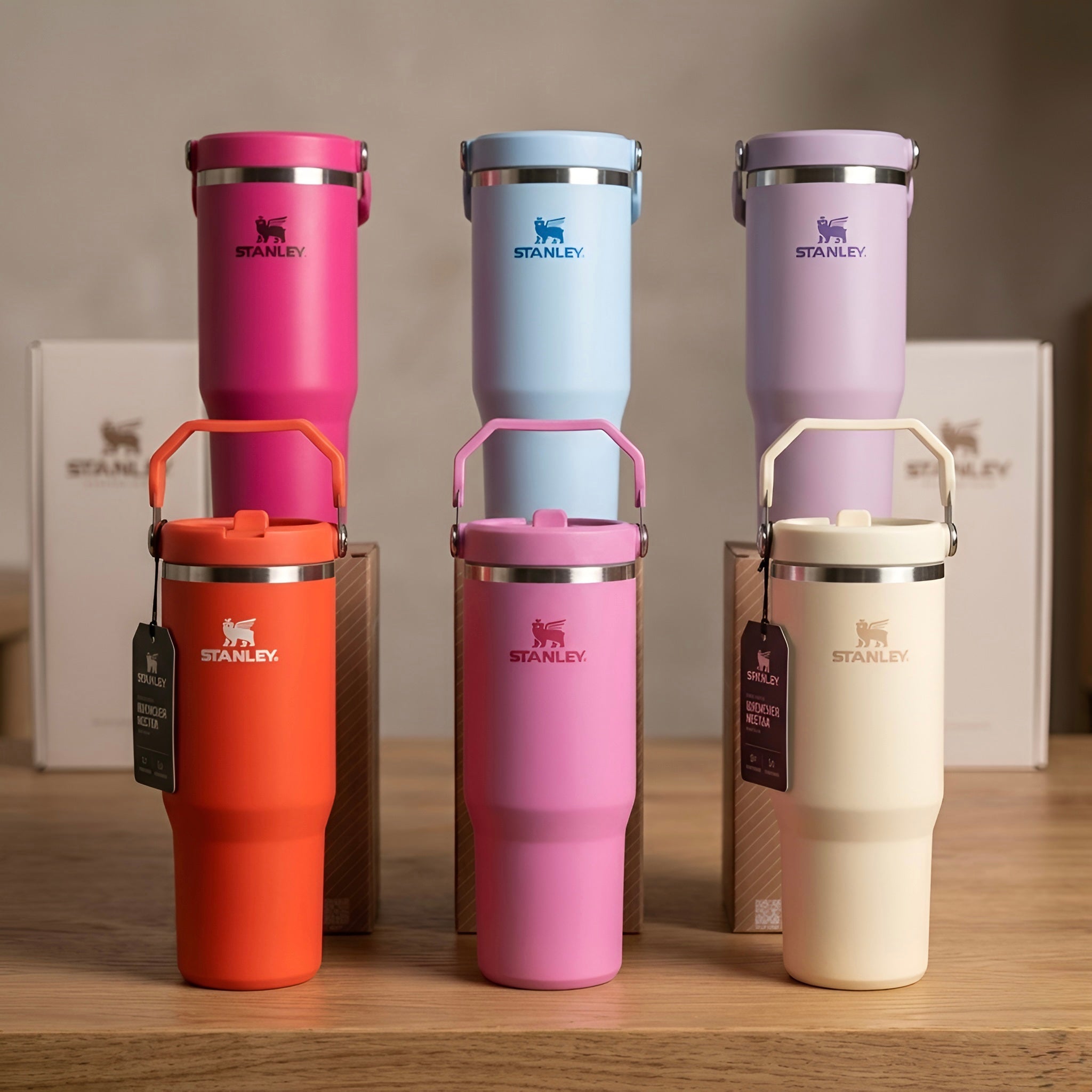 A collection of vibrant stanley boca iceflow flip straw insulated tumblers in pink blue lavender orange and cream colors