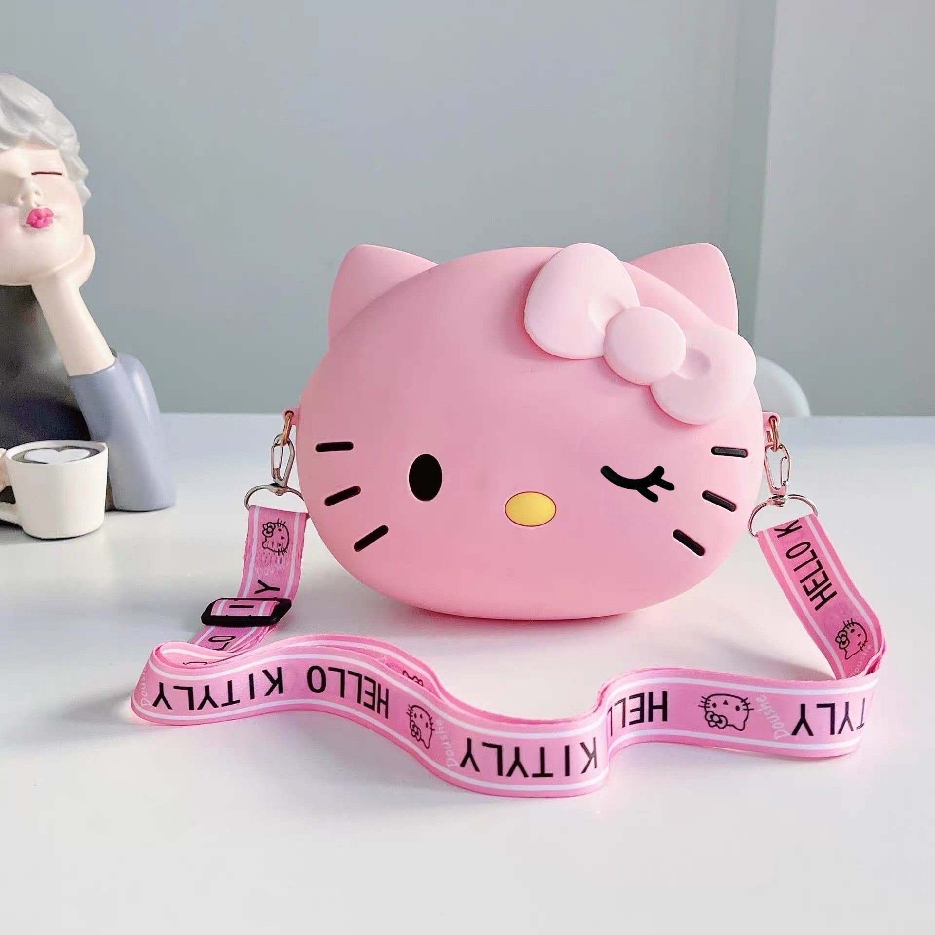 Roza Hello Kitty silikonska torbica s mašnom i kaišem