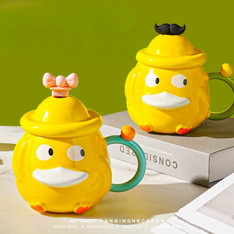 Žute keramičke šolje s poklopcem u obliku patke, idealne za keramički set čajnik